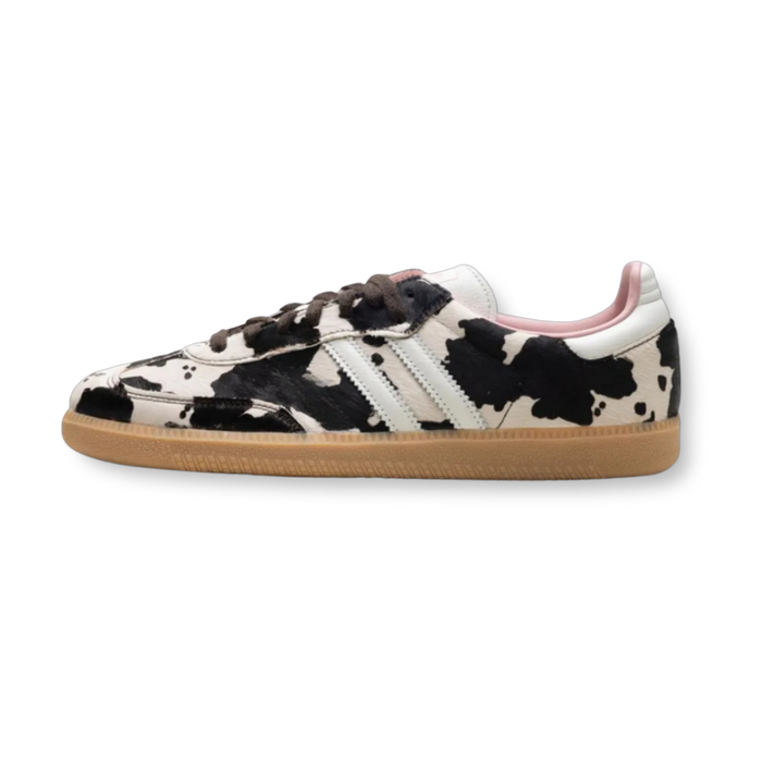 Cow print trainers with pink lining