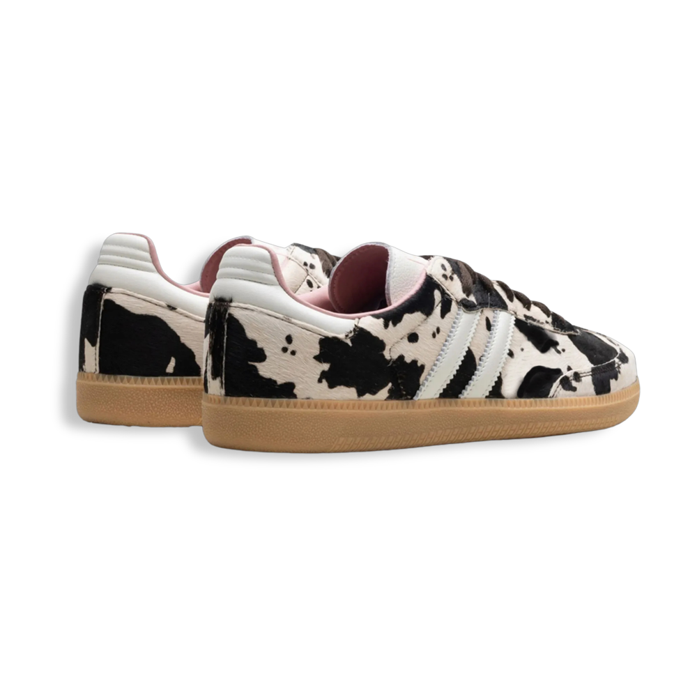 Cow print trainers with pink lining