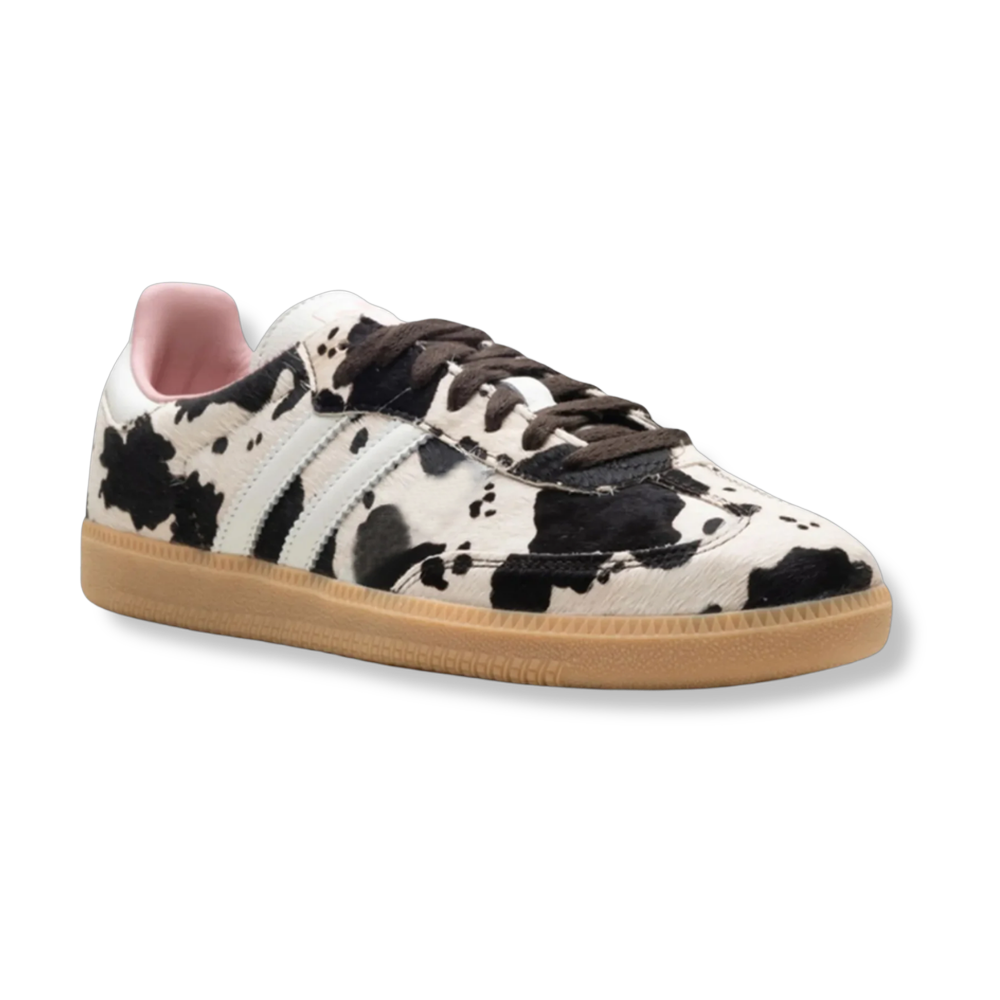 Cow print trainers with pink lining